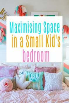 a bed with pink and blue pillows on it, next to a white sign that says maximum space in a small kid's bedroom