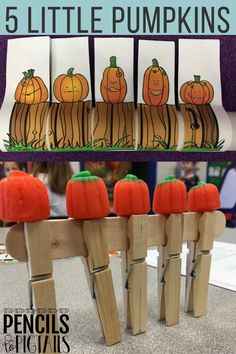 wooden pegs with pumpkins on them and the words 5 little pumpkins