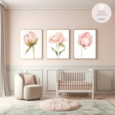 a baby's room with three pink flowers on the wall