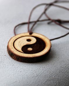 Oriental Yin Yang, Yin yang pendant necklace, Pendant Necklaces, Symbol Necklaces, Yin Yang, Zen, yoga, Meditation Gift, spiritual jewelry This wood pendant is cut from raw tree, it has delightful and nice smell. You can feel it as you are in the forest. This Ying yang engraved symbol wood pendant necklace is  designed by me Katie. The leather necklace is adjustable. it is handmade item. That is the new idea to bring this to the interested people. Hope i can help you get it into what you want and what you thought about. Zen Yoga, Symbol Necklace, Personalized Anniversary Gifts, Meditation Gifts, Ying Yang, Personalized Anniversary, Wood Pendant, Spiritual Jewelry, Leather Necklace