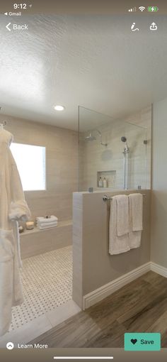 a bathroom with a walk in shower next to a sink