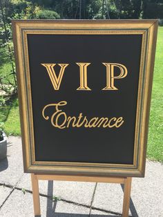 a black and gold sign with the words vip entrance written in gold on it