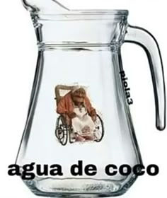 a glass pitcher with an image of a woman in a wheelchair