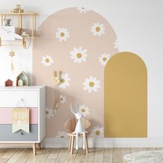 a child's room with flowers painted on the wall