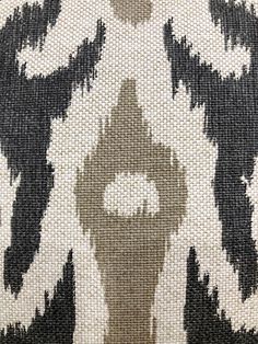 an upholstered black and white pattern on fabric