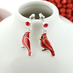 Silver tone post hook earrings featuring an enamel Christmas cardinal design. Cardinal measures about 2 cm in size. Cardinal Jewelry, Cardinal Design, Burr Basket, Christmas Cardinals, Hook Earrings, Stud Earring, Silver Plate, Silver Tone, Birds