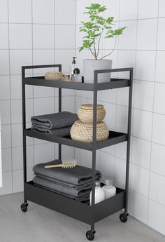 three tiered shelving unit in a bathroom