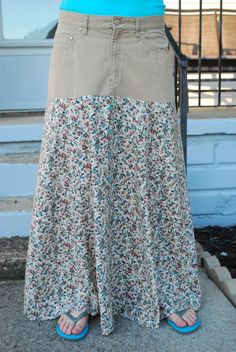 "I deconstruct and redesign jeans into beautiful, modest jean skirts. This is a one-of-a-kind skirt! This skirt is a size 12 CROSSROADS brand. The jean part is 10 1/2\" long, made of 100% cotton. I added 29\" of flowered 100% rayon. All seams are serged. Made in a smoke-free home. Measurements: Waist: 34\" Hips: 44\" Length: 39 1/2\" Around Hem: 94\" Button and zipper front closure If you would like to place a custom order, please send me an email. I will be happy to work with you on creating exactly the skirt you want." Diy Jean Skirt, Modest Jean Skirts, Modest Jeans, Jean Skirts, Creative Clothes, Long Denim Skirt, Repurposed Clothing