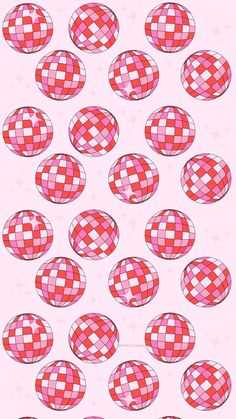 a bunch of red and white checkered balls on a pink background