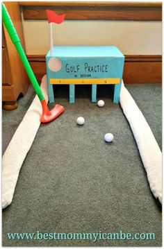 a golf practice bench with balls on the ground and a green tee in front of it