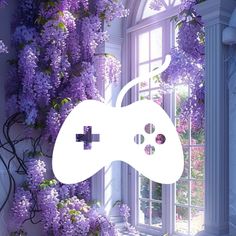 a video game controller in front of a window with purple flowers on the outside wall