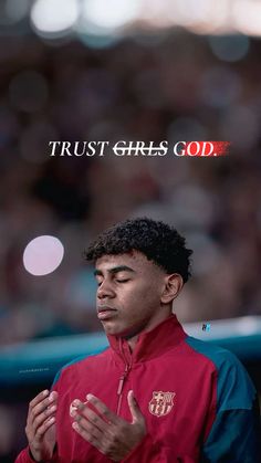 a man in a red jacket standing with his hands together and the words trust girls god above him