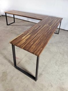 two tables made out of wood and metal