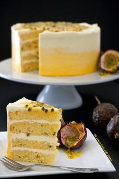 a piece of cake on a plate with a fork and some figs next to it