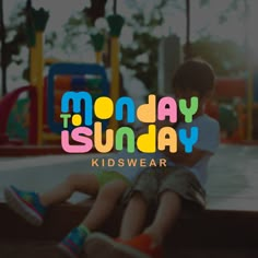 two children sitting on the ground in front of a playground with text reading monday sunday kidswear