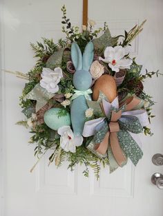 an easter wreath hanging on the front door