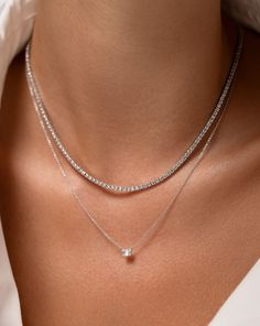 Tennis diamond necklace 14k solid gold Round, natural diamonds Color: I-J Clarity: SI 3 Carat: 212 diamonds on 16 inch necklace 241 diamonds on 18 inch necklace Width: 1.9 mm 5 Carat: 172 diamonds on 16 inch necklace 206 diamonds on 18 inch necklace Width: 2.3 mm 7 Carat: 155 diamonds on 16 inch necklace 174 diamonds on 18 inch necklace Width: 2.6 mm 9 Carat: 147 diamonds on 16 inch necklace 170 diamonds on 18 inch necklace Width: 2.7 mm Push clasp closure with safety latch Look Working Girl, Layering Diamond Necklaces, Illusion Necklace, Necklace Length Guide, Bracelet Size Chart, Diamond Tennis Necklace, Ring Concierge, 16 Inch Necklace, Kids Bracelets