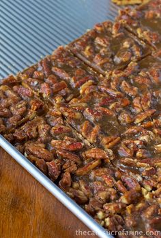 pecan bars are sitting in a pan on a table