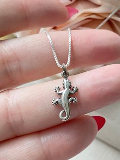 Please Read   Photos are enlarged to show detail. Please read the measurement in the description. Matching Earrings Here: https://www.etsy.com/listing/1689905301/sterling-silver-gecko-lever-back ☑️ The charm is .925 Sterling Silver and measures approximately 21x9mm. CHAINS: ☑️ The chains and components are .925 Sterling Silver. ☑️ The Satellite chain is 1mm thick with a 2mm ball. ☑️ The Staple chain is 2mm thick. ☑️ The Box chain is 1mm thick. ☑️ The Rope chain is 1.1mm thick. ❤️ Follow us on In The Satellite, Jewelry Chain, Waterproof Jewelry, Dream Jewelry, Gecko, Magnetic Clasp, Box Chain, Rope Chain, Matching Earrings