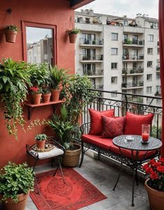 the balcony is decorated with potted plants and red cushions, along with an outdoor seating area