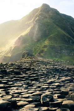 the giant stones are in front of a mountain