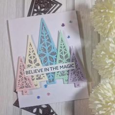 a card with the words believe in the magic on it