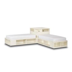 three white beds with storage drawers on each side and one bed in the middle, both made out of plywood