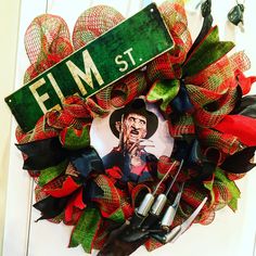 a wreath that has scissors and other items on it