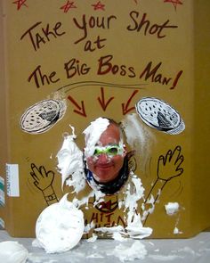 a cardboard box with white frosting on it and an image of a man's face