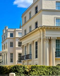 a large white building with many windows and balconies