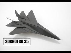 an origami fighter jet is on display with the words suko su 35 below it