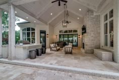 an outdoor living area with fireplace and grill