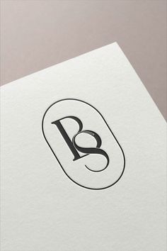 the letter b is inscribed in black on white paper