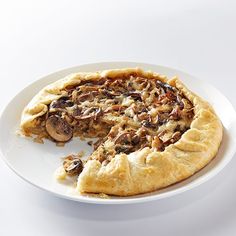 a white plate topped with a mushroom pie