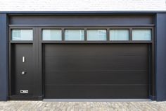 a black garage door with windows on the side