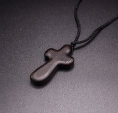 Introducing the Handmade Nightfall Wooden Cross Necklace, a timeless and meaningful piece designed for those seeking style and spirituality. Crafted from high-quality wood, this men's cross necklace exudes a minimalist, yet bold look. Perfect for daily wear, the dark wood finish enhances its rugged appeal, while the comfortable chain ensures ease. Whether for casual outings or meaningful moments, this cross necklace for men offers both a modern aesthetic and spiritual significance. Embrace the b Cross Jewelry Necklace, Wooden Watches For Men, Mens Cross Necklace, Clock Gift, Mens Crosses, Wooden Watch, Wooden Cross, Cross Jewelry, Wooden Rings