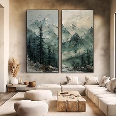 two paintings on the wall in a living room