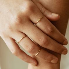 "DAINTY STACKING RING. Stack them or wear it alone. You will never want to take them off! I promise :). **Sold individually **Shower safe! ------------------------------- M A T E R I A L S * A N D * S I Z I N G 14Karat gold filled and shower safe! Size: 5,6, 7, 8 and 9 -------------------------------- W H A T * I S * G O L D * F I L L E D * G O L D * P L A T E D * A N D * V E R M E I L * M A T E R I A L GOLD FILLED: - Under normal wearing conditions and with proper care, your gold filled jewelry Minimalist Promise Jewelry, Adjustable Simple Design Crystal Ring, Simple Tiny Rose Gold Midi Rings, Adjustable Dainty Initial Ring For Promise, Minimalist Adjustable Initial Ring, Hypoallergenic, Adjustable Simple Midi Rings For Promise, Adjustable Rings For Everyday Wear, Minimalist Adjustable Hypoallergenic Initial Ring, Adjustable Minimalist Hypoallergenic Initial Ring