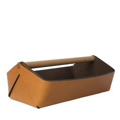 a brown leather box with a handle on the top and bottom, sitting in front of a white background