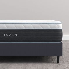 the haven mattress is sitting on top of a bed frame in front of a wall