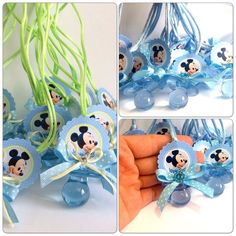 a bunch of blue and white decorations with mickey mouses on them for baby shower