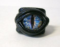 Dragon eye adjustable black leather ring. Snake by LeasBoutique, $19.99 Burning Man Costumes, Jurassic Craft, Ring Horror, Burning Men, Handmade Leather Jewelry, Fantasy Ring, Halloween Ring, Burning Man Costume, Leather Ring