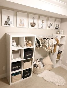 a white closet filled with lots of baby items