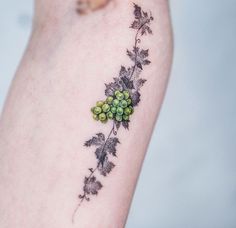 a close up of a person's arm with a tattoo design on the side