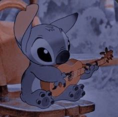 a cartoon koala playing an ukulele on a rocking chair