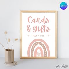 a pink and white poster with the words cards & gifts on it next to a plant