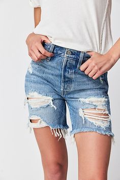 Vintage-inspired and season-spanning, these effortless cut-off shorts from Levi's are featured in a high-rise, longline silhouette with distressing throughout for added dimension. * Button-front closure * Five pocket style * High-rise design | Levi's 501 Mid Thigh Shorts at Free People in Light Wash, Size: 26 Levi's Cutoff Relaxed Fit Bottoms, Levi's Relaxed Fit Jean Shorts With Frayed Hem, Levi's Relaxed Fit Cutoff Shorts, Levi's High Rise Relaxed Fit Shorts, Distressed Short Leg Bottoms For Spring, Levi's Cutoff Jean Shorts For Spring, Ripped Relaxed Fit Shorts, Ripped Relaxed Fit Bottoms Of Short Length, Ripped Cutoff Bermuda Shorts For Spring