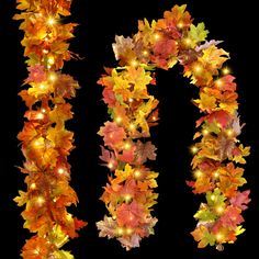 the letter o is made up of autumn leaves and lit with fairy lights on it