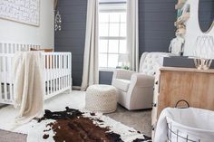 a baby's room is decorated in white and brown