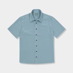 From GenTeal: "The vintage-styled Palmas Shirt is a short-sleeve button-up that is made to be worn untucked and by the water. Made with a unique blend of modal and polyester, it offers durability and comfort." 75% Modal, 25% Polyester Genuine horn buttons 8-button front Solid Relaxed Fit Camp Shirt, Solid Relaxed Fit Button-up Camp Shirt, Solid Color Short Sleeve Summer Shirt, Blue Short Sleeve Shirt For Summer, Unstructured Solid Camp Shirt For Summer, Light Blue Summer Shirt With Button Closure, Light Blue Short Sleeve Shirt For Summer, Blue Short Sleeve Shirt With Button Closure For Summer, Light Blue Short Sleeve Summer Shirt